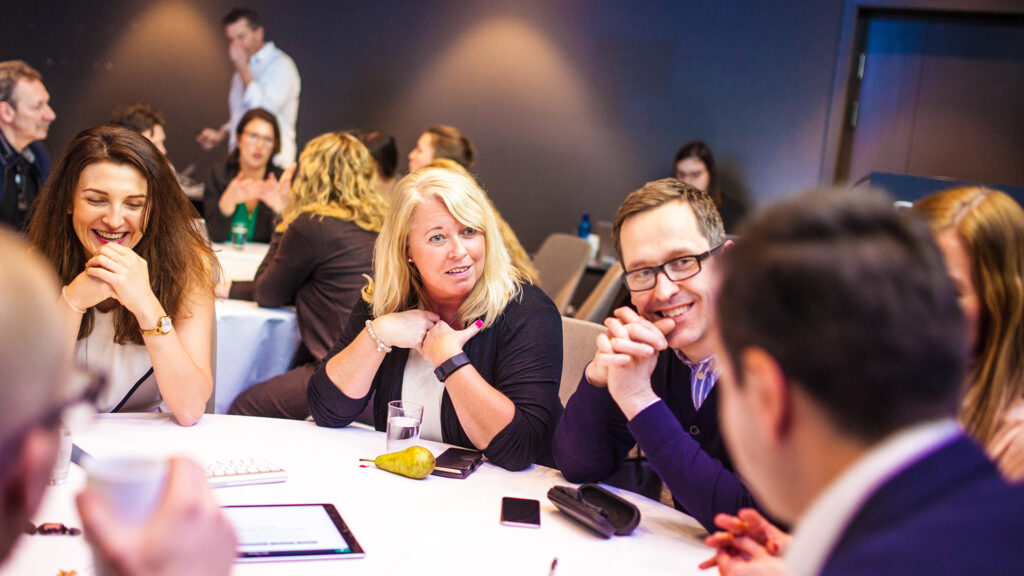 Diggle-conference-people-in-groups-around-table